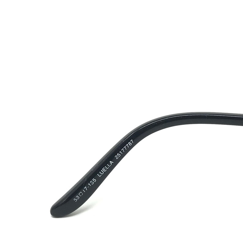 May include: Black eyeglasses arm with the text "53▢17-135 LUELLA 25177787" printed in white. The arm curves slightly and has a rounded tip.