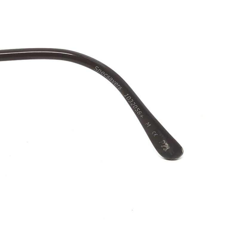 May include: Close-up of a black eyeglass arm with the text "Specsavers 1032056+ M ce P22" printed in white. The arm is curved and has a glossy finish. The background is white.