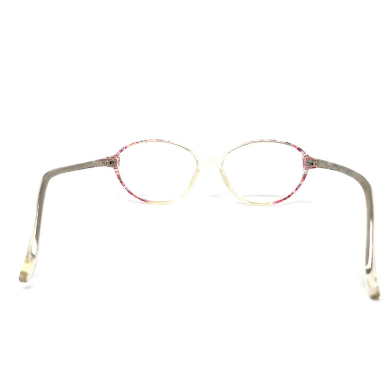 May include: Oval-shaped eyeglasses with a clear frame and gray temples. The rims are decorated with a pink floral pattern. The glasses are set against a white background.