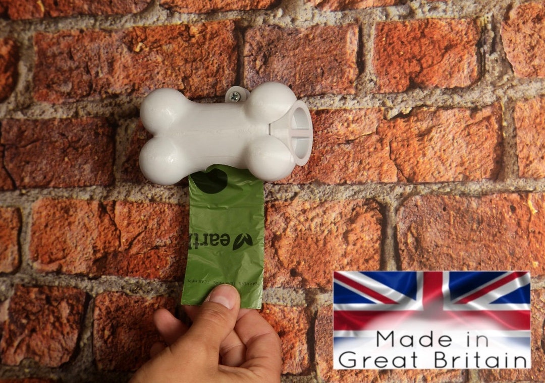 Poop bag clearance dispenser for wall