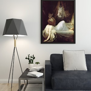 May include: A black framed print of a painting depicting a woman lying in bed with a demon and a horse's head hovering above her. The painting is set against a dark background.