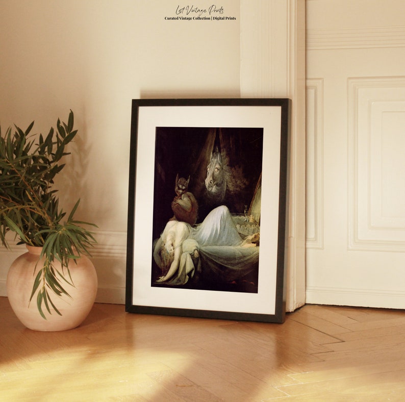 May include: A framed print of a vintage painting depicting a woman sleeping in a bed with a shadowy figure standing over her. The painting is set in a dark room with a single candle burning on a table.