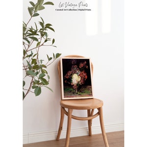 May include: A framed print of a still life painting featuring a bouquet of red, white, and pink flowers in a vase. The flowers are arranged in a vase on a green table. The background is dark.