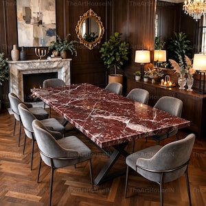 Op de afbeelding: Een rechthoekige eettafel met een gepolijst dieprood marmeren blad met witte aders en een zwart metalen X-vormig onderstel, omringd door acht grijze gestoffeerde stoelen met gebogen rugleuningen en dunne donkere metalen frames.