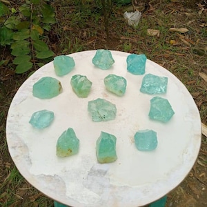 13 pcs 1302 gr ( 58-137 gr ) of rough Andara Crystal Turquoise Green with Bubbles monatomic