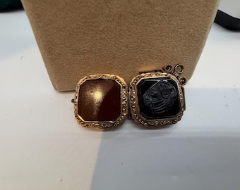 Pocket watch fob made to hold pictures.
