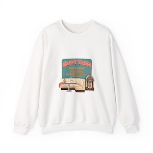 May include: White crewneck sweatshirt with a graphic featuring a diner scene with the text "Gravy Train Bottomless Brunch". The graphic includes a booth, table, and jukebox.