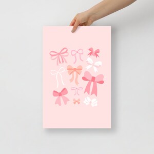 May include: Pink background with a variety of pink, peach, and white bows of different sizes and shapes.