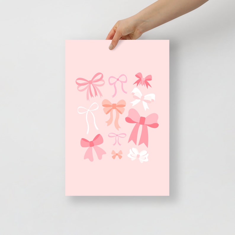 May include: Pink background with a variety of pink, peach, and white bows of different sizes and shapes.