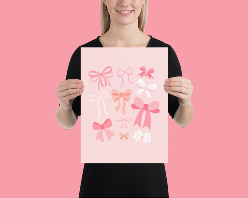 May include: A pink and white print with various pink and white bows. The print features a variety of bow shapes and sizes.