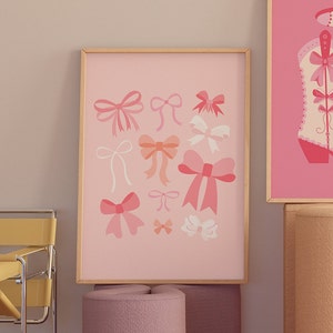 May include: A framed print with a pink background and a collection of pink and white bows in various sizes and shapes.