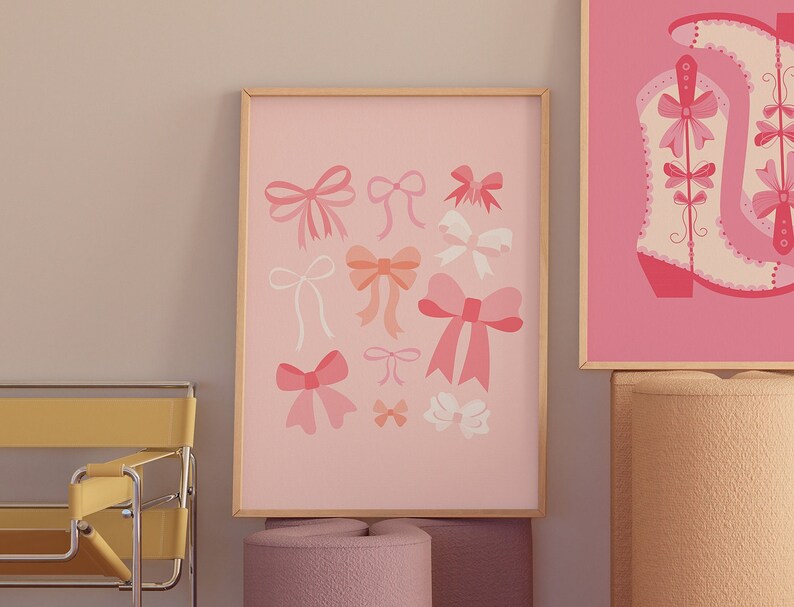 May include: A framed print with a pink background and a collection of pink and white bows in various sizes and shapes.