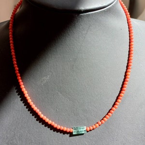 Necklace made of natural stones of red bamboo coral and green kyanite. Pearl necklace for women.