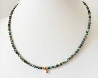 Necklace made of natural blue-green turquoise stones and a gold-plated key pendant. Women's necklace, jewelry for her.