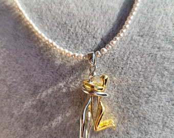Grey shell bead necklace, couple cuddling or dancing pendant. Delicate finish. Couple pendant.