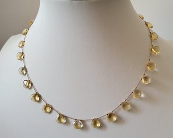 Necklace made of natural pear-shaped golden yellow citrine stones strung on brown silk thread. Gift for women. Minimalist necklace.