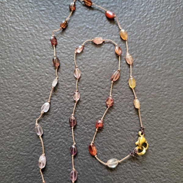 Necklace of natural pink multi-spinel stones knotted on a pink silk thread. Delicate minimalist fine necklace for women.
