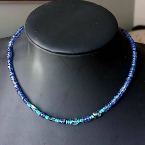 Necklace made of natural blue cyanite, blue topaz and turquoise stones. Necklace for women made of semi-precious stones. precious.