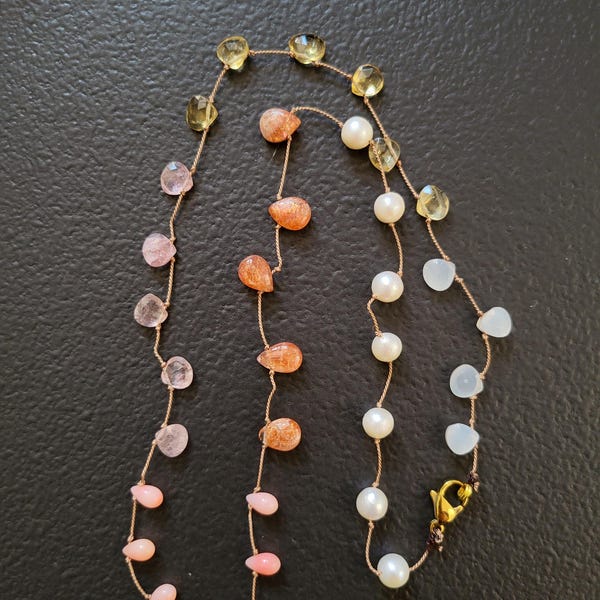 Necklace made of natural stones: orange sunstone, yellow citrine, pink coral, cultured pearl, moonstone, rose quartz, silk thread
