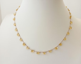 Necklace made of natural pear-shaped golden yellow citrine stones strung on brown silk thread. Gift for women. Minimalist necklace.
