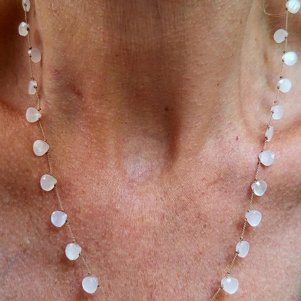 Necklace made of white moonstones tied together with silk thread, pear shape. Delicate, minimalist, fine necklace.