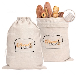 May include: Two beige drawstring bread bags with the words "Bread Bag" in an orange script font inside a bread-shaped outline. One bag is open and filled with various loaves of bread. The other bag is closed.