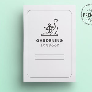 May include: A white gardening logbook with a black line drawing of a plant and a shovel. The text "GARDENING LOGBOOK" is printed in black below the drawing. The words "The PREMIUM Quality" are printed in a circle in the upper right corner.