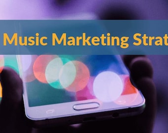 May include: A close-up of a smartphone screen with a blurred background of colorful lights. The text "Music Marketing Strategies" is displayed on a blue banner at the top of the image.