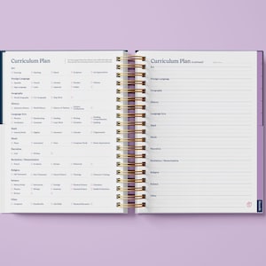 May include: A purple and blue planner with a gold spiral binding. The cover has the text "Curriculum Plan" printed on it. The pages are lined and have checkboxes for different subjects.
