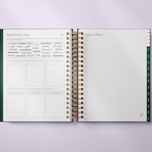 May include: Open spiral-bound planner with a green cover and gold spiral binding. The left page has a section titled "Map Out Your Vision" with prompts and a list of words. The right page is titled "Space to Dream" and has dotted grid paper.