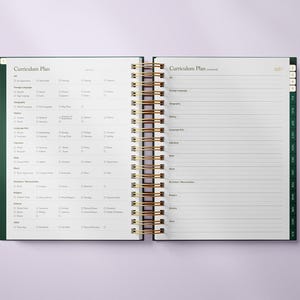 May include: Open, spiral-bound planner with gold coils and a dark green cover. The pages are white with a curriculum plan layout, featuring sections for various subjects. The text "Curriculum Plan" is visible at the top of the left page.