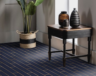 May include: A black side table with a wooden top and three legs. The table has a drawer and is decorated with three vases: one brown, one black and white, and one white.