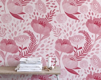 May include: Pink floral wallpaper with a watercolor effect. The pattern features pink flowers, leaves, and small pink dots on a light pink background.