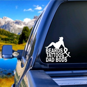 May include: White vinyl decal with a silhouette of a person sitting down with the text "BEARDS & TATTOOS DAD BODS".