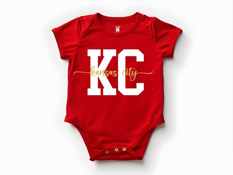 May include: Red baby onesie with white lettering that says "KC Kansas City" in a gold script font.