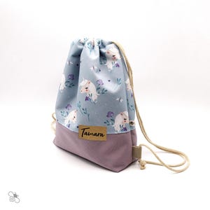 Turnbeutel aus wasserabweisendem Outdoorstoff mit Einhorn- & Blumen-Print, personalisiert, gefüttert / zwei Größen / eigenes Design