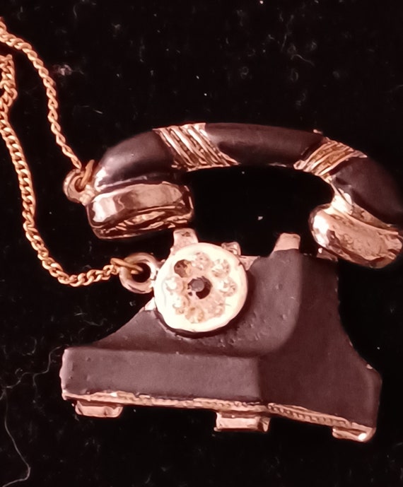 Telephone brooch