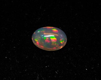 4.18ct Ethiopian Opal Oval shaped cabochon - Natural dark base opal gemstone for jewelry making - multi fire opal cabochon