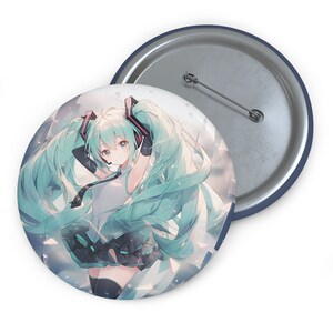 May include: A round button featuring a colorful anime character with long green hair, wearing headphones and a short skirt. The character is set against a background of white and blue geometric shapes.