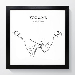 May include: Black and white line art print of two hands intertwined with the text "YOU & ME SINCE 2009" and the names "Olivia" and "Ray" written in cursive.