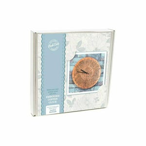 May include: A craft kit for an embossed copper clock, presented in a box. The clock face features a detailed, circular design with a copper finish. The box has a floral pattern and the text "Embossed Copper Clock."
