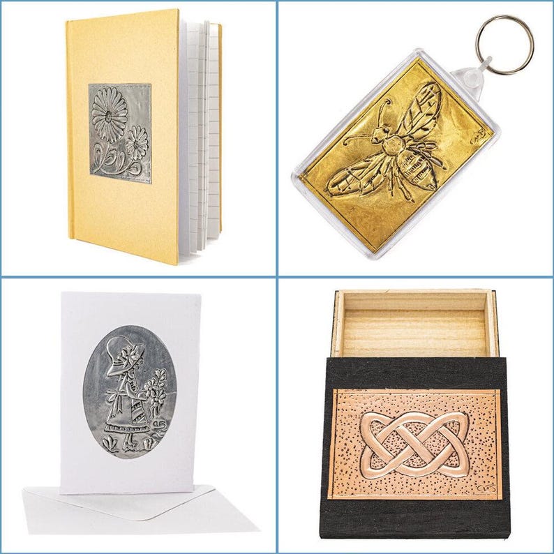 metal embossing starter kit laid out with aluminium, copper, gold foil, and pewter sheets, wooden box, A6 notebook, card and envelope, key fob, embossing tools, paints, tracing paper, and instruction booklet, Flat lay of a metal embossing craft kit including pre-cut aluminium, copper, gold foil, and pewter sheets, a small wooden box, A6 notebook, greeting card with envelope, plastic key ring, embossing tool, foam brush, sandpaper, tracing paper, adhesive sheet, and full-colour instructions
