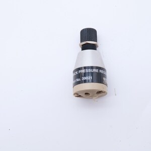 May include: A back pressure regulator with a black adjustment knob, silver body, and a beige base. The black label reads "BACK PRESSURE REG" and "Part No. 39021".