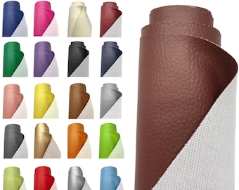 May include: Thirty different colors of faux leather fabric rolls. Each roll is half white and half a different color, including red, blue, green, yellow, and brown.