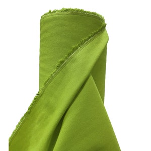 May include: A roll of bright green fabric with a fringed edge.