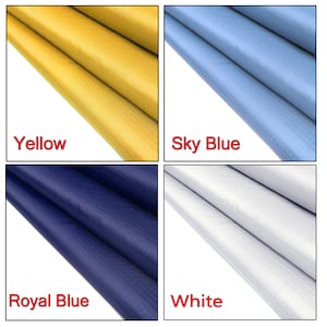 May include: Four fabric swatches in different colors: yellow, sky blue, royal blue, and white. The fabric has a subtle texture.