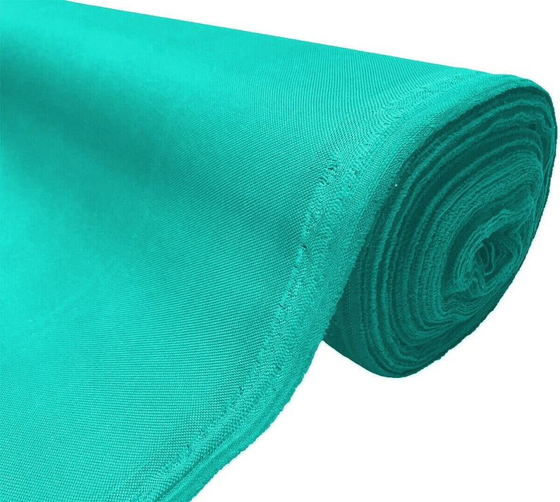 May include: A roll of turquoise fabric. The fabric is smooth and has a slight sheen.