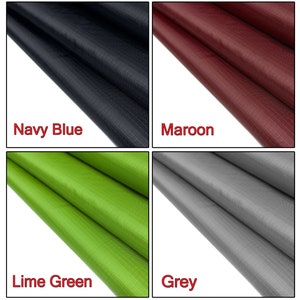 May include: Four fabric swatches in different colors: navy blue, maroon, lime green, and gray. The fabric has a subtle grid pattern.