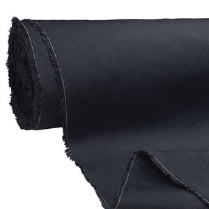 May include: A roll of dark blue fabric with a fringed edge.