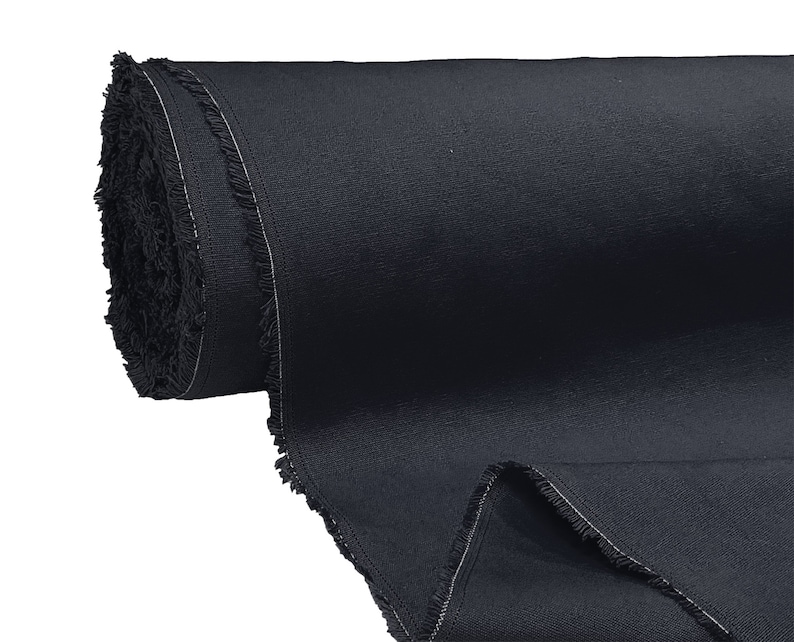 May include: A roll of dark blue fabric with a fringed edge.